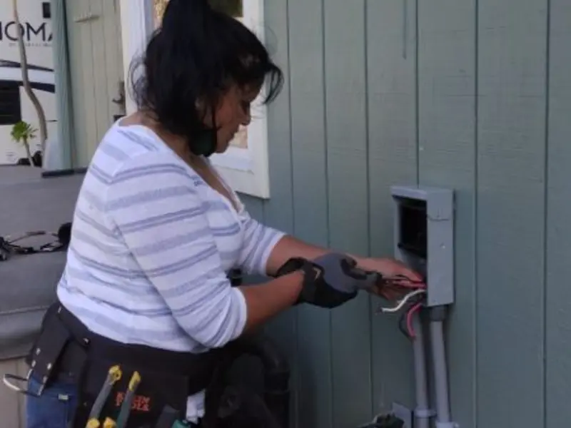 Licensed electrician wiring an exterior subpanel in Montgomery Village