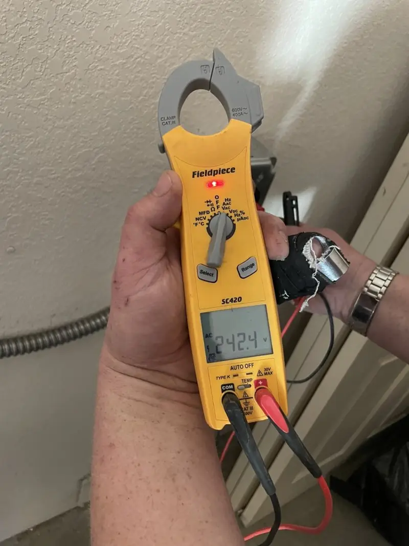 Voltage testing with clamp meter during Ceiling Fan Installation in Montgomery Village
